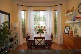 This diy bay window curtain rod costs less than $10 to make! Curtains On Bay Window Bay Window Curtains Bay Window Treatments Home