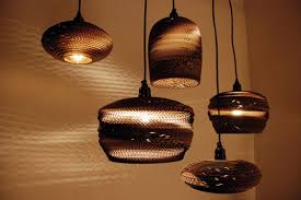 You've decided to remodel your kitchen or bathroom and upgrade your fixtures. Scrap Lights Made From Twice Recycled Cardboard