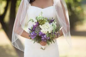Teal and purple in peacock wedding. Natural Purple Green Bridal Bouquet