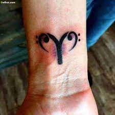 Black and grey aries with banner tattoo on man left shoulder. Aries Tattoos 50 Designs With Meanings Ideas Body Art Guru