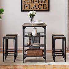 Thanks to the clean design, its charm is understated in a rustic kind of way. Amazon Com O K Furniture 5 Piece Dining Room Table Set Bar Pub Table Set Industrial Style Counter Height Kitchen Table With 4 Backless Bar Stools For Dining Area Gray Brown Finish Table