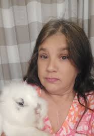 Siamese cat guards bathroom door