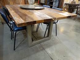 A solid reclaimed wood top proudly wears its history in the natural. Wood Dining Table Features Reclaimed Wood In Rustic Hues