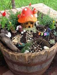 I have several fairy gardens and i will add these to the others and use this great box on my desk. 9 Enchanting Fairy Gardens To Build With Your Kids Kids Fairy Garden Miniature Fairy Gardens Fairy Garden Diy