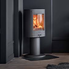 We have a corner wood stove so i'm just trying to think of ideas for it.nick wants to tear it out though. Artisan Contura 870 Corner Wood Burning Stove Artisan Fireplace Design
