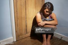 Young Woman Sitting On Floor In Corner Of Room Holding Knees To Chest Pose Reference Photo Life Drawing Reference Stock Photography