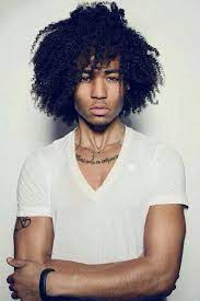 For sharp and classic haircuts for black men, keep your hair closely cropped (about one inch or less all over) and create a side parting to produce a contemporary and polished effect (or you can simply leave it as it is). Big Curly Hair Black Men Novocom Top