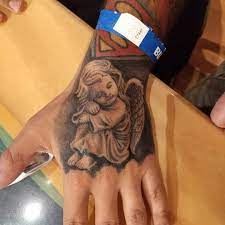 Pin By Treezy Gomez On Tattoos Cherub Tattoo True Tattoo Angel Hand Tattoo