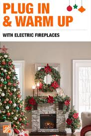 Simply Plug In And Warm Up With An Electric Fireplace From The Home Depot This Easy Fu Christmas Fireplace Decor Christmas Arrangements Christmas Decorations