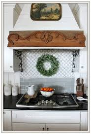 This elegant french country kitchen features a small island with shelf storage and a marble countertop. From My Front Porch To Yours Simple Winter French Country Farmhouse Kitchen