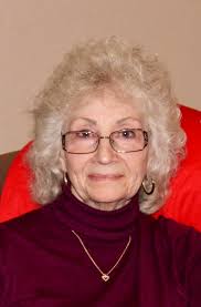 Can anyone remove the red truck in the background please? She was laid to  rest today, and notice the Eagle looking over her grave❤️