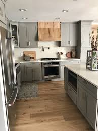 Grey Shaker Kitchen Cabinets With Quartz Countertops And Backsplash Custom Wood Hood Modern Kitchen Kitchen Remodel Modern Grey Kitchen Kitchen Design