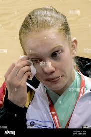 Jenny Brunner of Germany wipes away tears as her teammates finish off a  practice session for the Gymnastics World Championships at the NRGi Arena  in Aarhus, Denmark, Thursday Oct. 11, 2006. Brunner
