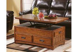 Well you're in luck, because here they come. Cross Island Coffee Table With Lift Top Ashley Furniture Homestore