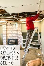 Dropped ceilings make the space feel more closed in as the ceilings are a bit lower than they need to be and can look like more of a mobile home, hospital or office and not like your home in any way. One Room Challenge Week 2 Replacing A Basement Drop Tile Ceiling The Happy Housie