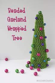 Check spelling or type a new query. Christmas Tree Craft Beaded Garland Wrapped Tree Kindergarten Christmas Crafts Beaded Garland Holiday Garlands