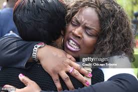 Latrice Boyd, left, who lost her son Frederick James Giles to... News Photo 