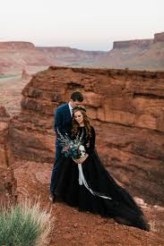 A charming bow detail makes a playful finishing touch for this. 5 Reasons You Should Consider A Black Wedding Dress For Your Adventure Elopement Moab Elopement Photographer Adventure Wedding Elopement Photographers In Moab Yosemite And Beyond The Hearnes