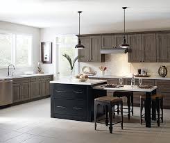 White kitchen cabinets brighten up this kitchen, providing contrast to dark wood flooring and deep blue walls. Laminate Kitchen Cabinets Masterbrand