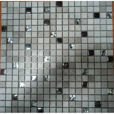 Made from porcelain in a solid neutral finish, these tiles strike a small circular shape to create a dotted pattern in your space. Stone Glass Mosaic Mirror Tile