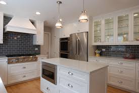 white cabinets, gray subway tile