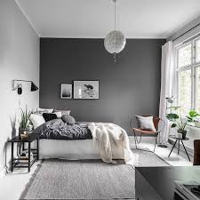 The key is, instead of painting the entire space in a dark color, to just paint one wall (or a single element like a bookcase), as seen in the image above from royal roulotte.dark colors read as receding from the viewer, so the accent wall visually enlarges the space (and sets up a nice contrast that can make the rest of the space seem brighter by comparison). Living Room One Grey Wall Decorating With Natural Elements Bring The Outdoors In With This Elegant Decorating Trend Living Room Grey Home Sofas For Small Spaces The Paint Color Adds