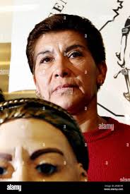Juana Barraza, 48, is presented to the media next to a bust the police used  to help in the search for a serial murder suspect at the Mexico City police  headquarters Wednesday