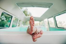This will help you have an air of confidence that will make you seem appealing to someone who's a little more mature. Legs Of Unrecognizable Barefoot Woman Lying On Back Of Seat Inside Vintage Van During Trip In Nature Stockphoto