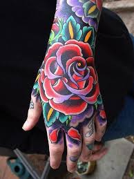 Traditional Style Rose Tattoo On Hand Traditional Rose Tattoos Hand Tattoos For Guys Rose Hand Tattoo