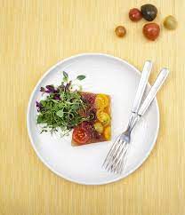 The name terrine also refers to the earthenware vessel used to cook it, which also serves as a mold. Summer Tomato Terrine Cook Feastmagazine Com