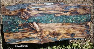 River run coffee table with deep brown epoxy and metal legs. River Rock Coffee Table