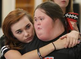 PHOTOS: Teammates Support Special Cheerleader