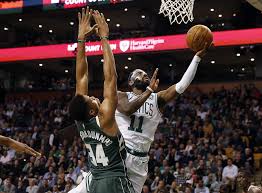Giannis antetokounmpo leaves recreation after grotesque hyperextension of left knee hawks' trae younger out for sport 4 with bone bruise on foot. Kyrie Irving Outduels Giannis Antetokounmpo In Third Quarter Of Boston Celtics Win Over Milwaukee Bucks Masslive Com