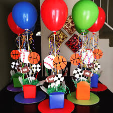 We added the symbol of the gender as a decoration. Sports Theme Centerpieces Diy 1st Birthday Sports Themed Birthday Party Sports Party Centerpieces Sports Birthday Party