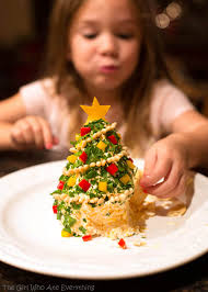 Arrange tomatoes and cheese following a christmas tree shape: Christmas Cheese Tree The Girl Who Ate Everything