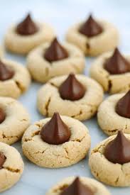 These chocolate cookies have hershey's kisses milk chocolates tucked into the middle for another bit of sweetness. Classic Peanut Butter Kiss Cookies Recipe Jessica Gavin