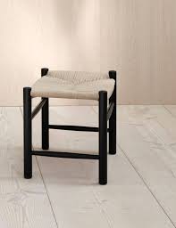 Designed in 1944, wegner 's rocker with the sensually curved arms was inspired by traditional windsor and shaker furniture, fused with wegner's poetic lines. J16 Taburet