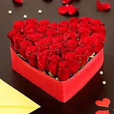 Filling heart shape flower box with roses. Beautiful Roses With Heart Shape Box