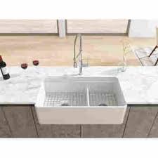 Most fireclay farmhouse sinks will measure somewhere between 30 and 36 inches wide and 10 inches deep. Latoscana Ldl3619w 36 Reversible Double Bowl Fireclay Farmhouse Sink Qualitybath Com