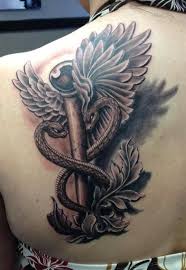 Nurse cap with medical symbol tattoo. 12 Medical Symbol Tattoos On Back