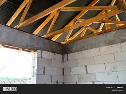 In this example, timber battens are fixed to the hollow block wall with rigid or fibre insulation installed. Roof Trusses Covered Image Photo Free Trial Bigstock