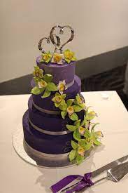 4 Tier Purple Wedding Cake With Lime Green Orchids And A Silver Heart Topper Lime Green Weddings Plum Wedding Colors Purple And Green Wedding