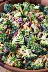 Broccoli Salad Sugar Spun Run This delicious broccoli salad includes two bunches of fresh broccoli, raisins or dried cranberries, sunflower seeds, carrots, purple onion, mayo, sugar or honey, and bacon. broccoli salad sugar spun run
