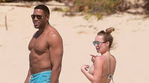 Hold up… business casual is outdated. Michael Strahan Shows Plenty Of Pda With Bikini Clad Girlfriend Kayla Quick During Sexy Vacay See The Pics Entertainment Tonight