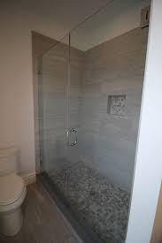 In this idea, frameless glass shower doors are the main item to add to the white and grey bathroom. Gray Bathroom Shower Ideas K B Construction Home Builders Remodeling Bergen County Nj