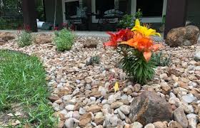 A catch basin will collect standing water, allowing it to drain properly, and a french drain pipe uses small holes to collect the water while leaving the soil intact. How To Add Drainage To A Flower Bed With Pictures Home Efficiency Guide