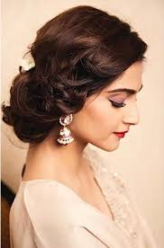 The veil is placed right under a classical smooth top bun. Buy Bun Hairstyle For Gown Cheap Online