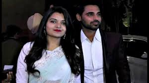 He is spending unmarried life with his family. Bhuvneshwar Kumar With Wife Nupur Nagar Attend Virat Kohli Anushka Sharma Mumbai Reception Youtube