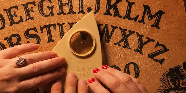 Why does the Ouija board feel as if it is moving?