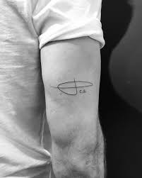 These tattoos are super trendy and stylish. Mother Signature Tattoo On The Back Of The Left Arm
